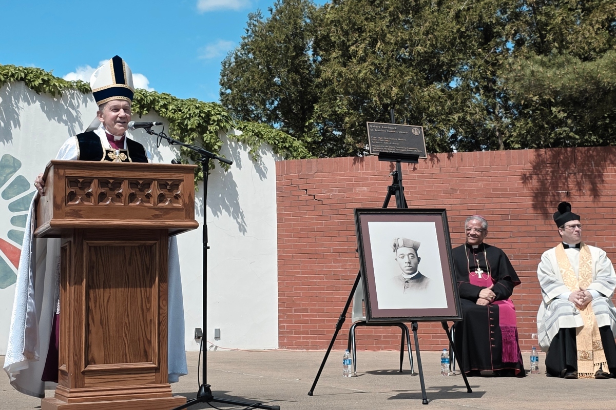 Springfield Diocese Bishop Thomas John Paprocki (left) speaks at a ceremony in Quincy honoring Fr. Augustine Tolton.