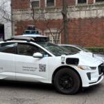 A Waymo vehicle drives through Chicago’s Near North Side on March 20 as the company begins testing and mapping the city. (Medill Illinois News Bureau photo by Georgia Epiphaniou)