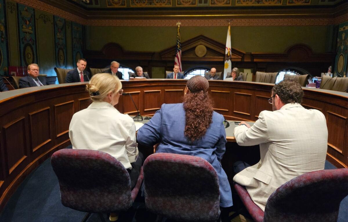Officials from the Department of Central Management Services testify before the legislative Commission on Government Forecasting and Accountability about expected cost increases next year in the state employee group health insurance system. (Capitol News Illinois photo by Peter Hancock)