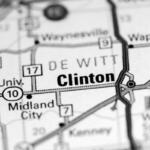 Close-up map showing Clinton with nearby towns and highways (Interstate 10, 54, 17) in a black-and-white route layout