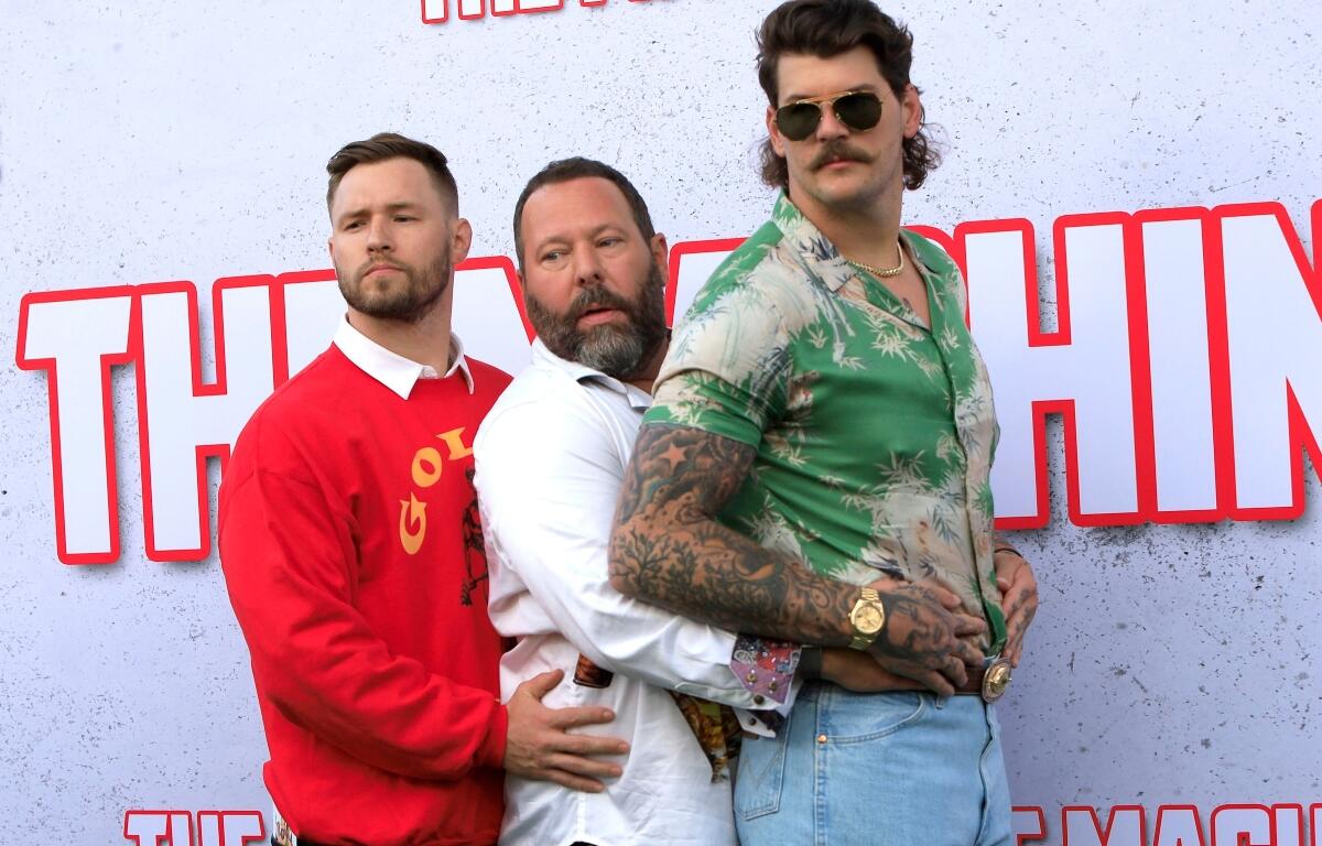 William Compton, Bert Kreischer, Taylor Lewan at The Machine Premiere at the Village Theater on May 25, 2023 in Westwood, CA
