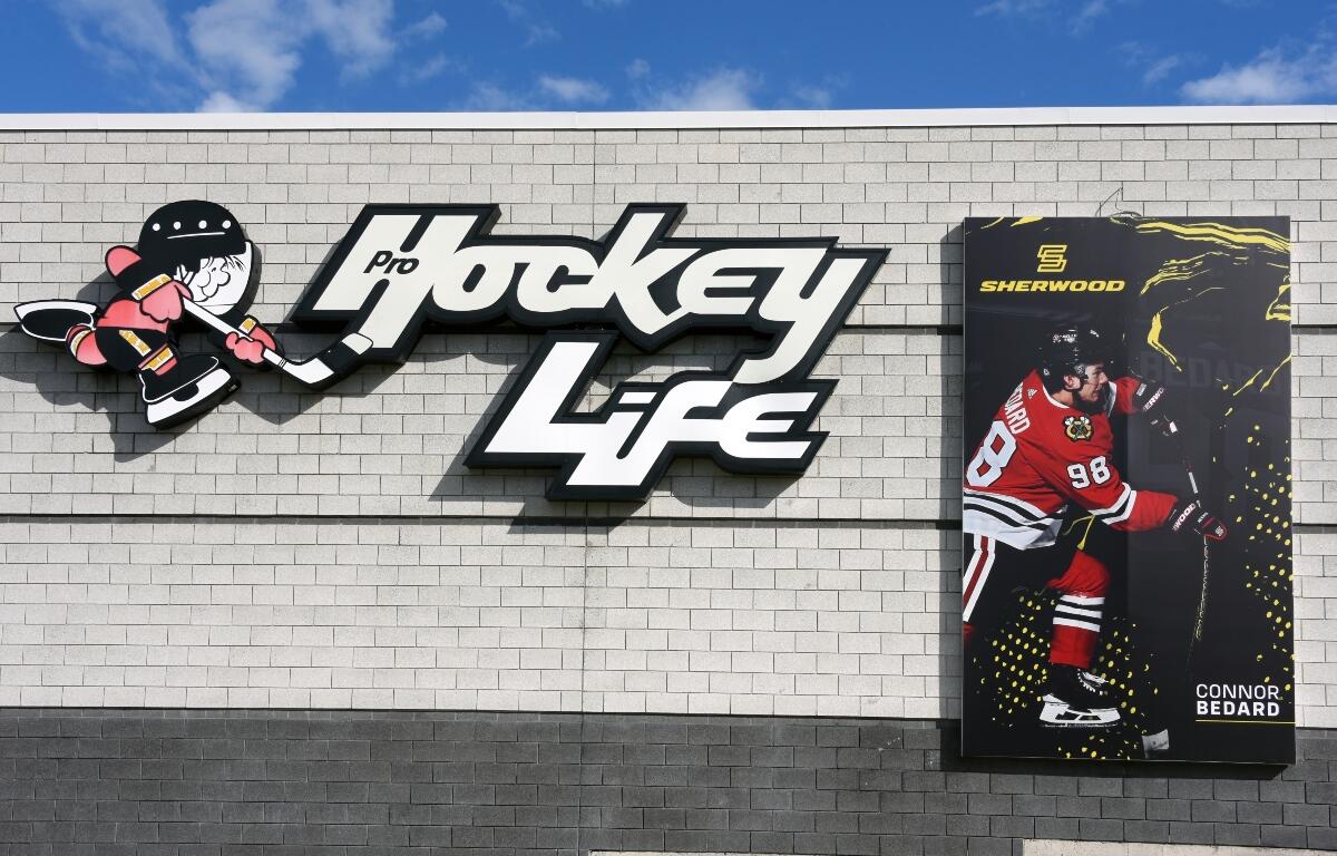 Connor Bedard poster on the side of a building.