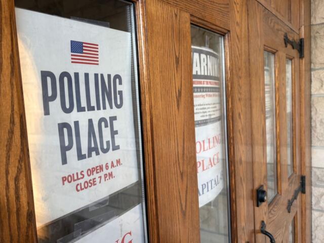 A sign shows polling place hours in Sangamon County on March 17, 2026. (Capitol News Illinois photo by Jerry Nowicki)