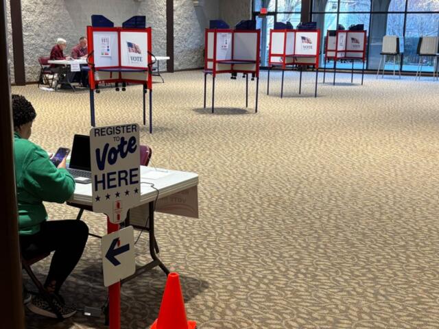 Stand-up voting booths and a registration table at a Sangamon County polling place in March 2017. (Capitol News Illinois photo by Jerry Nowicki)