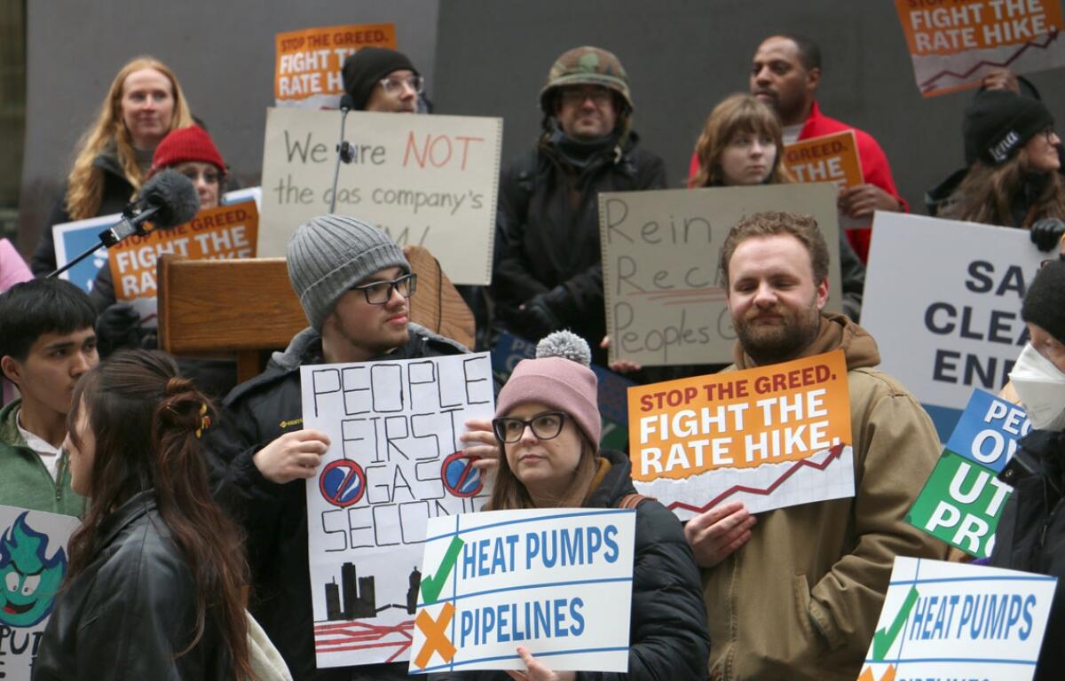 Customers and utility watchdogs took to Daley Plaza with signs and chanting to denounce Peoples Gas’ January rate hike request. The April 1, 2026, demonstration drew over 100 participants. (Capitol News Illinois photo by Maggie Dougherty)