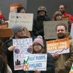 Customers and utility watchdogs took to Daley Plaza with signs and chanting to denounce Peoples Gas’ January rate hike request. The April 1, 2026, demonstration drew over 100 participants. (Capitol News Illinois photo by Maggie Dougherty)