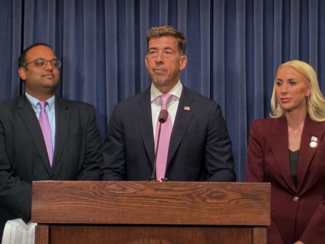 Secretary of State Alexi Giannoulias, middle, holds a news conference in Springfield on e-bike regulation alongside Sen. Darby Hills, R-Barrington Hills, right, and Sen. Ram Villivalam, D-Chicago, left, on April 15, 2026. (Capitol News Illinois photo by Ben Szalinski)