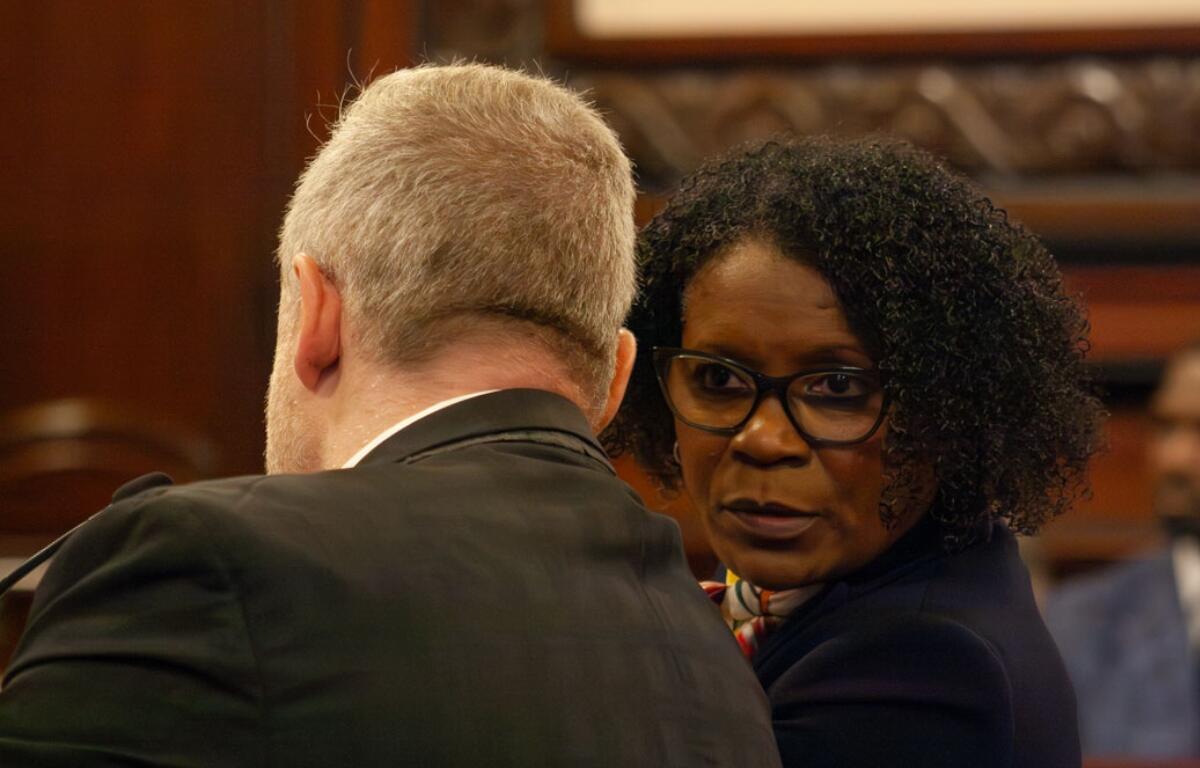State Sen. Adriene Johnson talks to Planned Parenthood Illinois Action lobbyist Michael Zirir during a Senate committee hearing on Wednesday, April 29, 2026. (Capitol News Illinois photo by Jenna Schweikert)