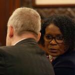 State Sen. Adriene Johnson talks to Planned Parenthood Illinois Action lobbyist Michael Zirir during a Senate committee hearing on Wednesday, April 29, 2026. (Capitol News Illinois photo by Jenna Schweikert)