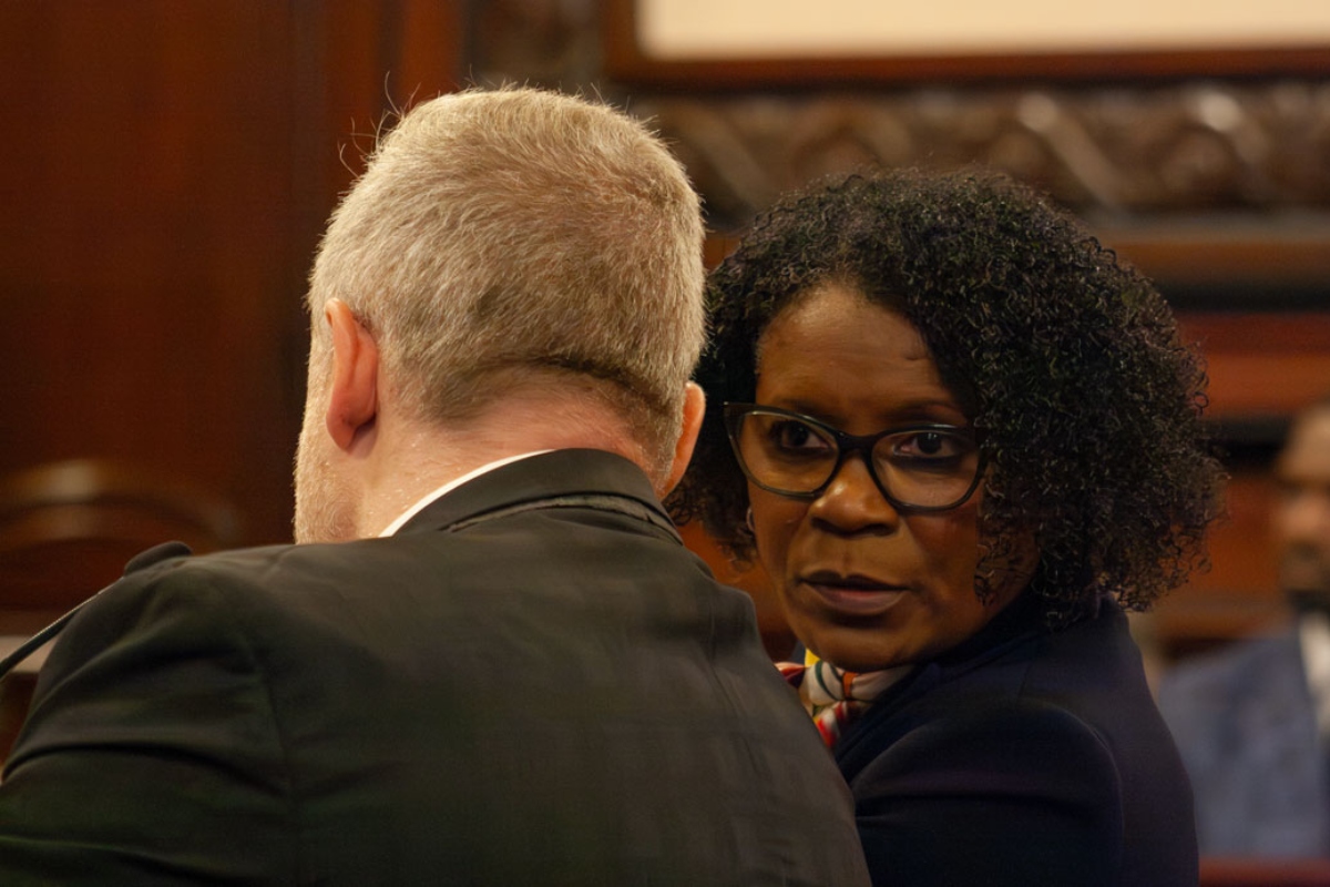 State Sen. Adriene Johnson talks to Planned Parenthood Illinois Action lobbyist Michael Zirir during a Senate committee hearing on Wednesday, April 29, 2026. (Capitol News Illinois photo by Jenna Schweikert)