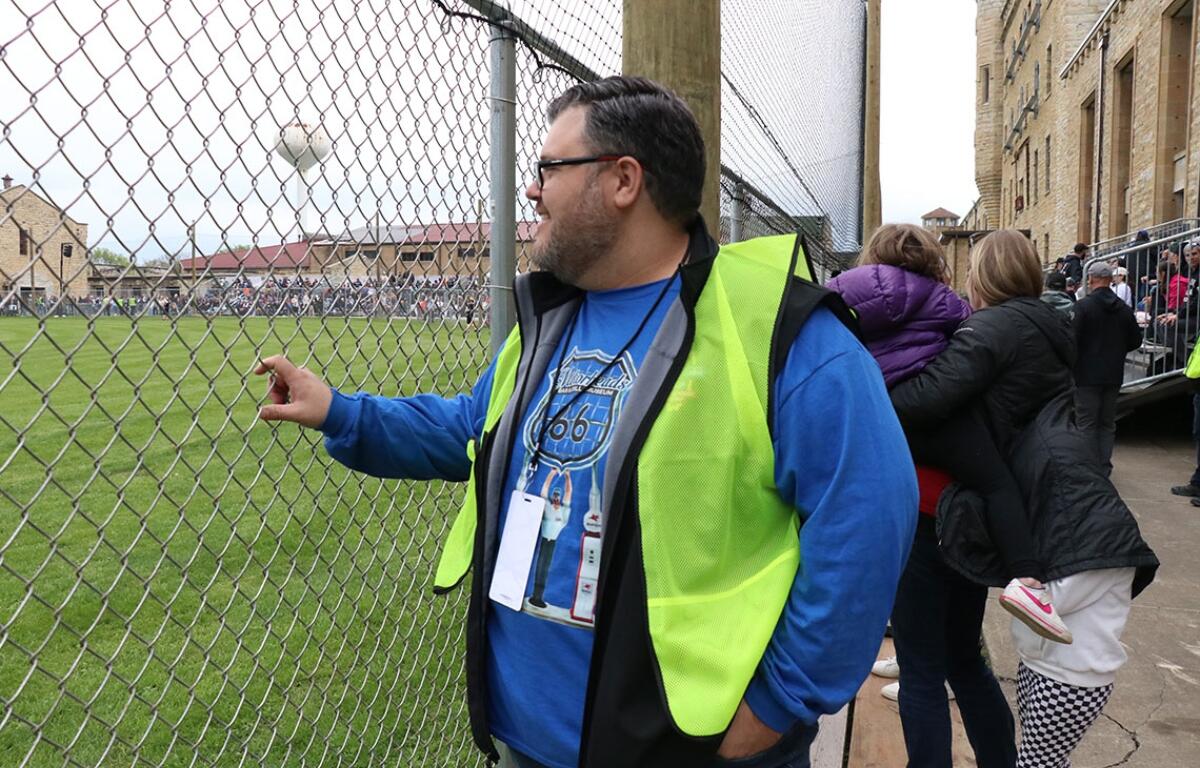 Darrin Thurman watched the baseball game while assisting attendees. (Medill Illinois News Bureau photo by Chloe Park)