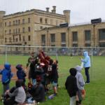 A player from the Joliet Slammers gives away a foul ball to spectators at the kickoff baseball game on April 30 at the Old Joliet Prison. (Medill Illinois News Bureau photo by Julia Levy)