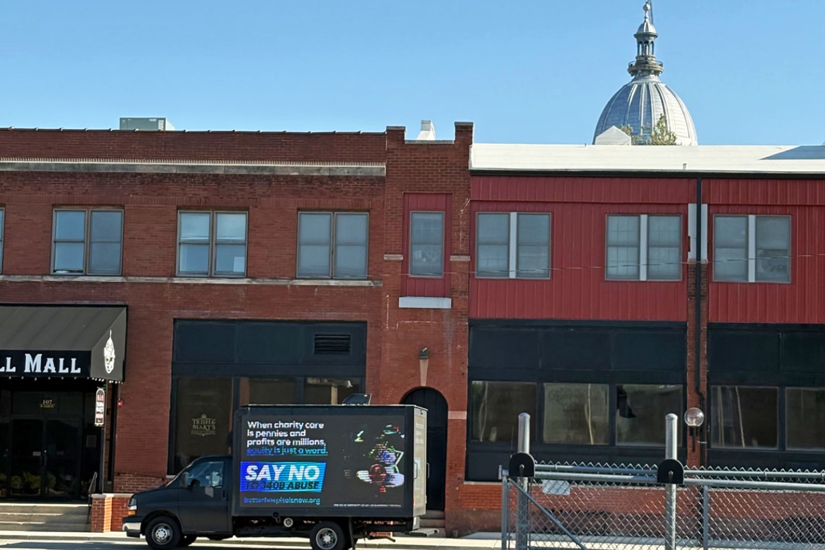 A billboard truck urges lawmakers to “say no to 340B abuse” as it makes its rounds in the Vinegar Hill neighborhood surrounding the Illinois State Capitol. (Capitol News Illinois photo by Jerry Nowicki)
