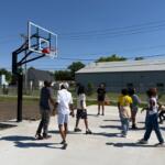 Kids and others play basketball on a court newly installed at the Boys and Girls Club location at 15th and Monroe.