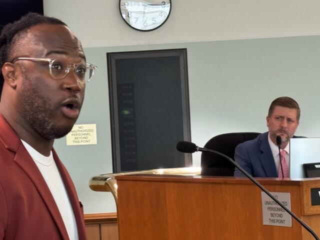 Dominic Watson (left) of the Springfield Project discusses economic development with the Springfield City Council, May 19, 2026