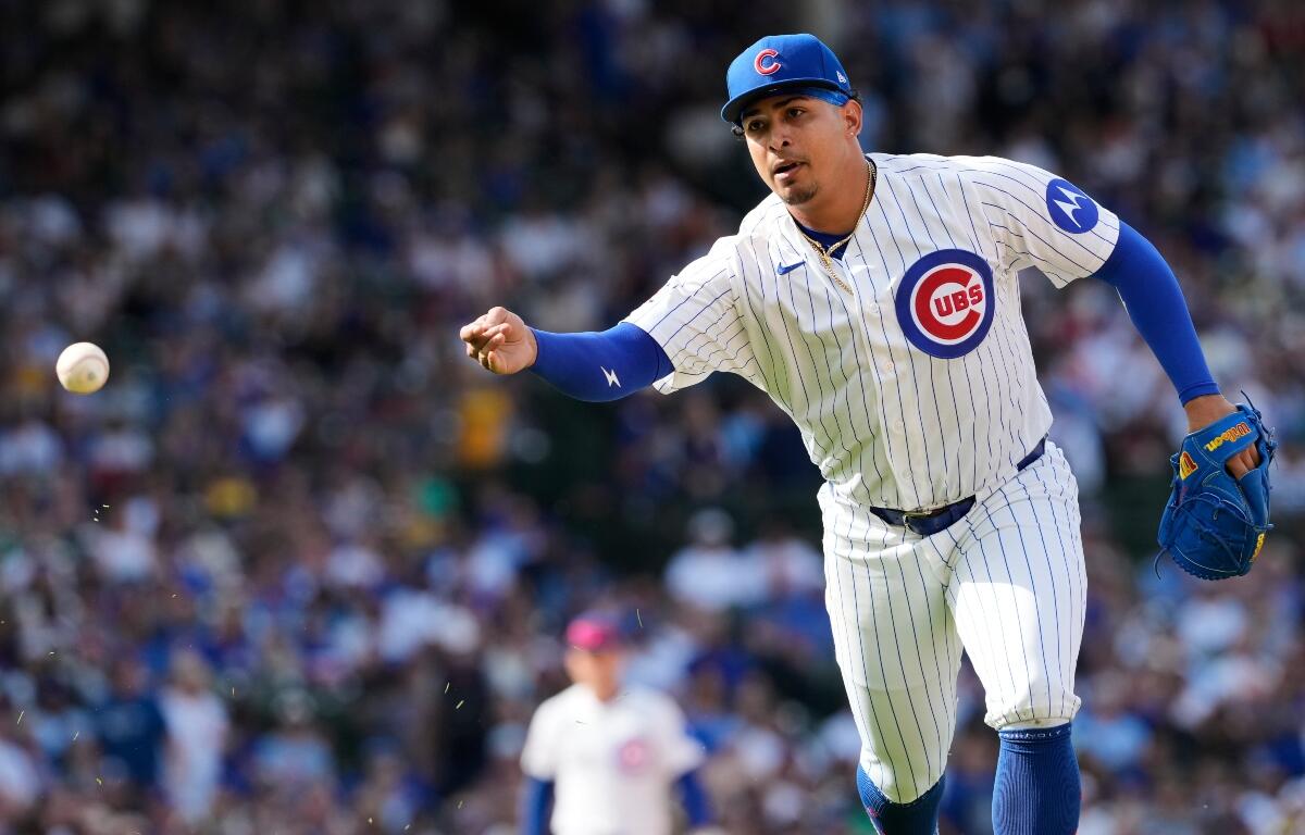 Chicago Cubs relief pitcher Daniel Palencia throws out Pittsburgh Pirates' Joey Bart at first base during the ninth inning of a baseball game in Chicago, Sunday, April 12, 2026. (AP Photo/Nam Y. Huh)