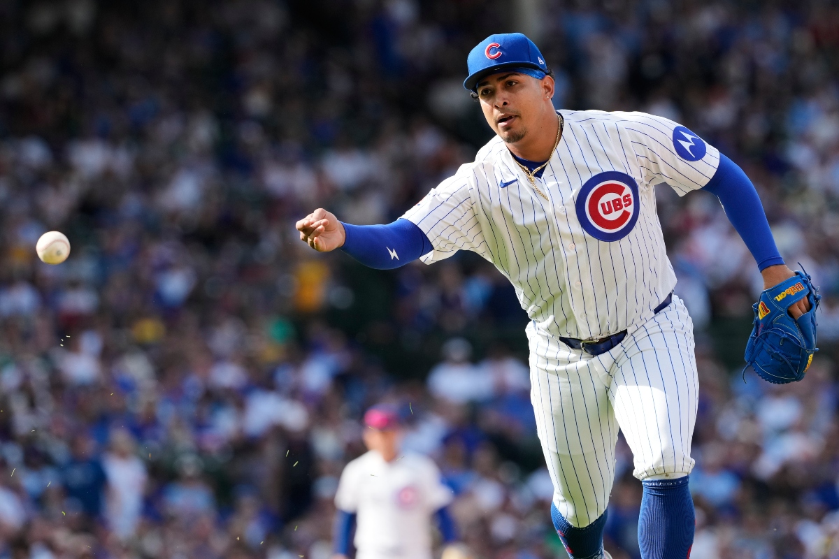 Chicago Cubs relief pitcher Daniel Palencia throws out Pittsburgh Pirates' Joey Bart at first base during the ninth inning of a baseball game in Chicago, Sunday, April 12, 2026. (AP Photo/Nam Y. Huh)