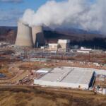 FILE - A data center owned by Amazon Web Services, front right, is under construction next to the Susquehanna nuclear power plant in Berwick, Pa., Jan. 14, 2025. (AP Photo/Ted Shaffrey, File)
