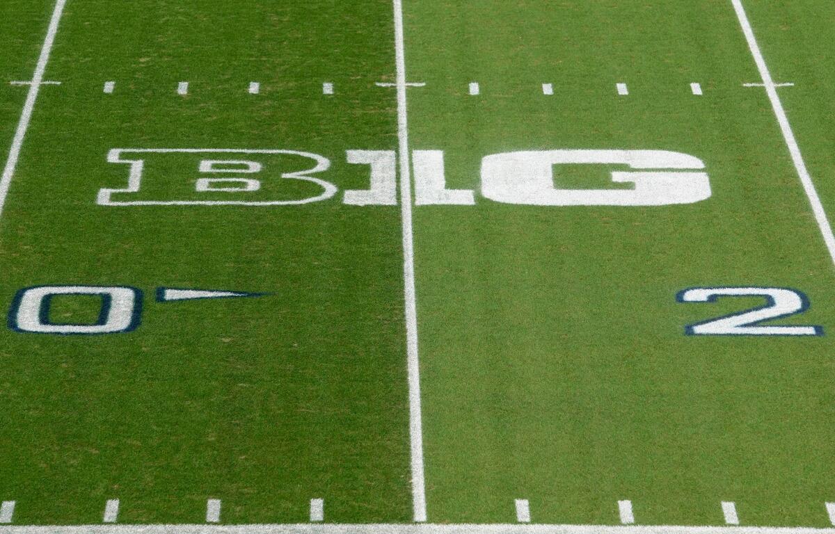 FILE - The Big Ten logo is painted between the 30 and 40 yard lines at Beaver Stadium before an NCAA college football game between Indiana and Penn State in State College, Pa., on Saturday, Oct. 2, 2021. (AP Photo/Barry Reeger, File)