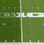 FILE - The Big Ten logo is painted between the 30 and 40 yard lines at Beaver Stadium before an NCAA college football game between Indiana and Penn State in State College, Pa., on Saturday, Oct. 2, 2021. (AP Photo/Barry Reeger, File)