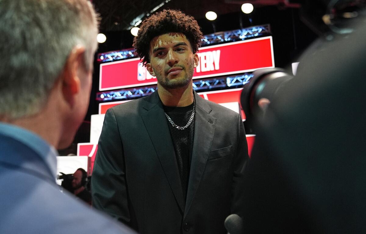 Duke forward Cameron Boozer talks to media during the NBA basketball draft lottery in Chicago, Sunday, May 10, 2026. (AP Photo/Nam Y. Huh)