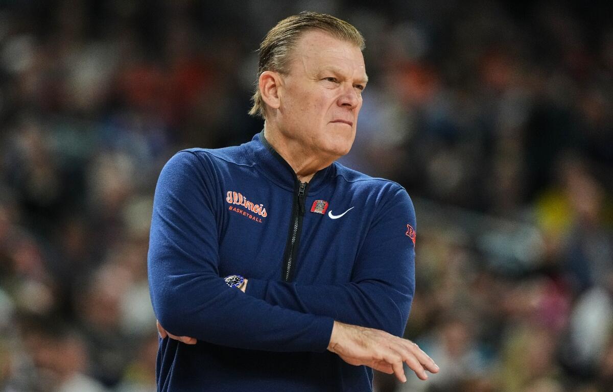 FILE - Illinois head coach Brad Underwood watches froom the sidelines during the first half of an NCAA college basketball tournament semifinal game against UConn at the Final Four, April 4, 2026, in Indianapolis. (AP Photo/Michael Conroy, File)