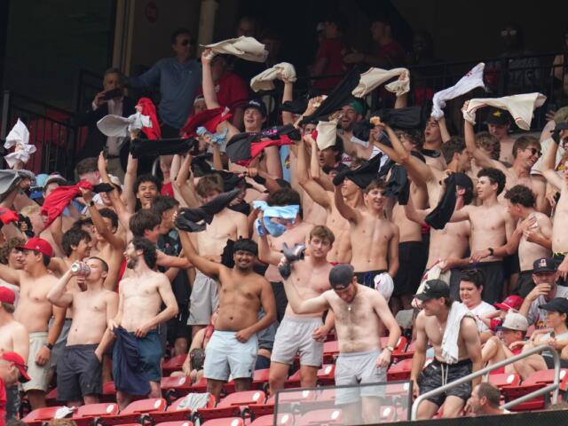 Fans cheer and wave their shirts above their heads during the fourth inning of a baseball game between the St. Louis Cardinals and the Kansas City Royals Saturday, May 16, 2026, in St. Louis. (AP Photo/Jeff Roberson)