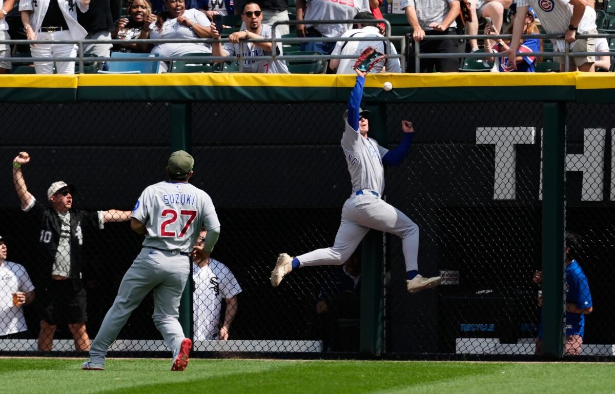 Chicago Cubs center fielder Pete Crow-Armstrong, right, cannot catch a two-run double hit by Chicago White Sox's Miguel Vargas during the fifth inning of a baseball game in Chicago, Sunday, May 17, 2026. (AP Photo/Nam Y. Huh)