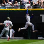 Chicago Cubs center fielder Pete Crow-Armstrong, right, cannot catch a two-run double hit by Chicago White Sox's Miguel Vargas during the fifth inning of a baseball game in Chicago, Sunday, May 17, 2026. (AP Photo/Nam Y. Huh)