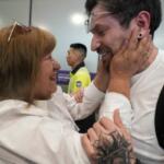 Kyle Adler, a 36-year-old Chilean American who was taken from his family at nine months old and illegally adopted, embraces his birth mother, Ana Maria Navarrete, after traveling from the U.S. to meet her for the first time, in Santiago, Chile, Saturday, Feb. 14, 2026. (AP Photo/Esteban Felix)