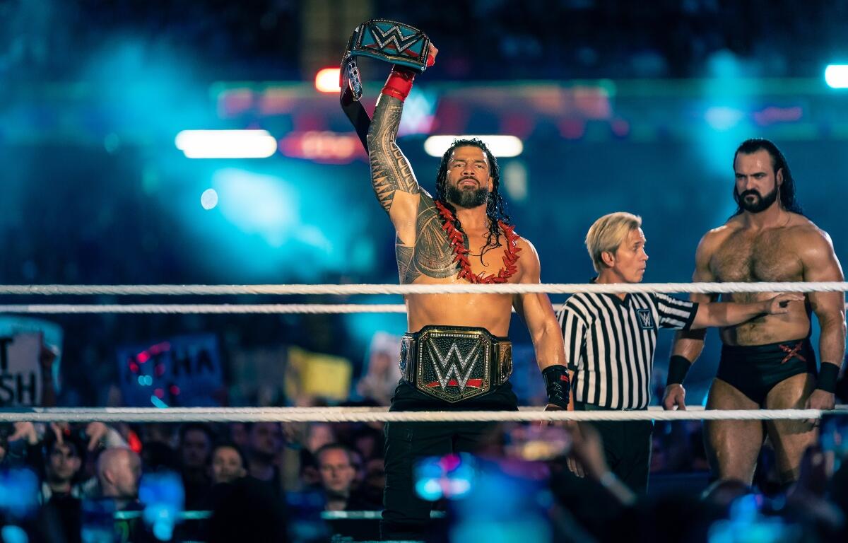 Cardiff, Wales - September 3rd 2022: WWE Champion Roman Reigns holding up the championship belt in the ring at WWE Clash at the Castle