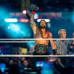 Cardiff, Wales - September 3rd 2022: WWE Champion Roman Reigns holding up the championship belt in the ring at WWE Clash at the Castle