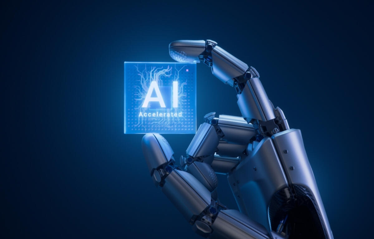 Robotic hand holding a glowing AI 'Accelerated' sign against a dark blue background—tech AI theme.