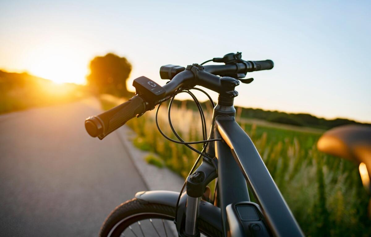 E-bike on the country road at sunset