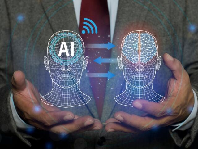 Machine learning with data technology. Robot inputting information from a human head into its own. futuristic digital network technology, innovation. AI Learning and Artificial Intelligence concept