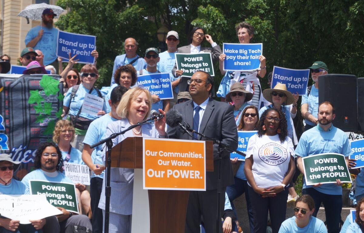 Robyn Gabel, D-Evanston, and Sen. Ram Villivalam, D-Chicago, speak at a rally for the POWER Act, a bill regulating data centers, about the bill’s next steps after the session ends. (Capitol News Illinois photo by Peter Hancock)