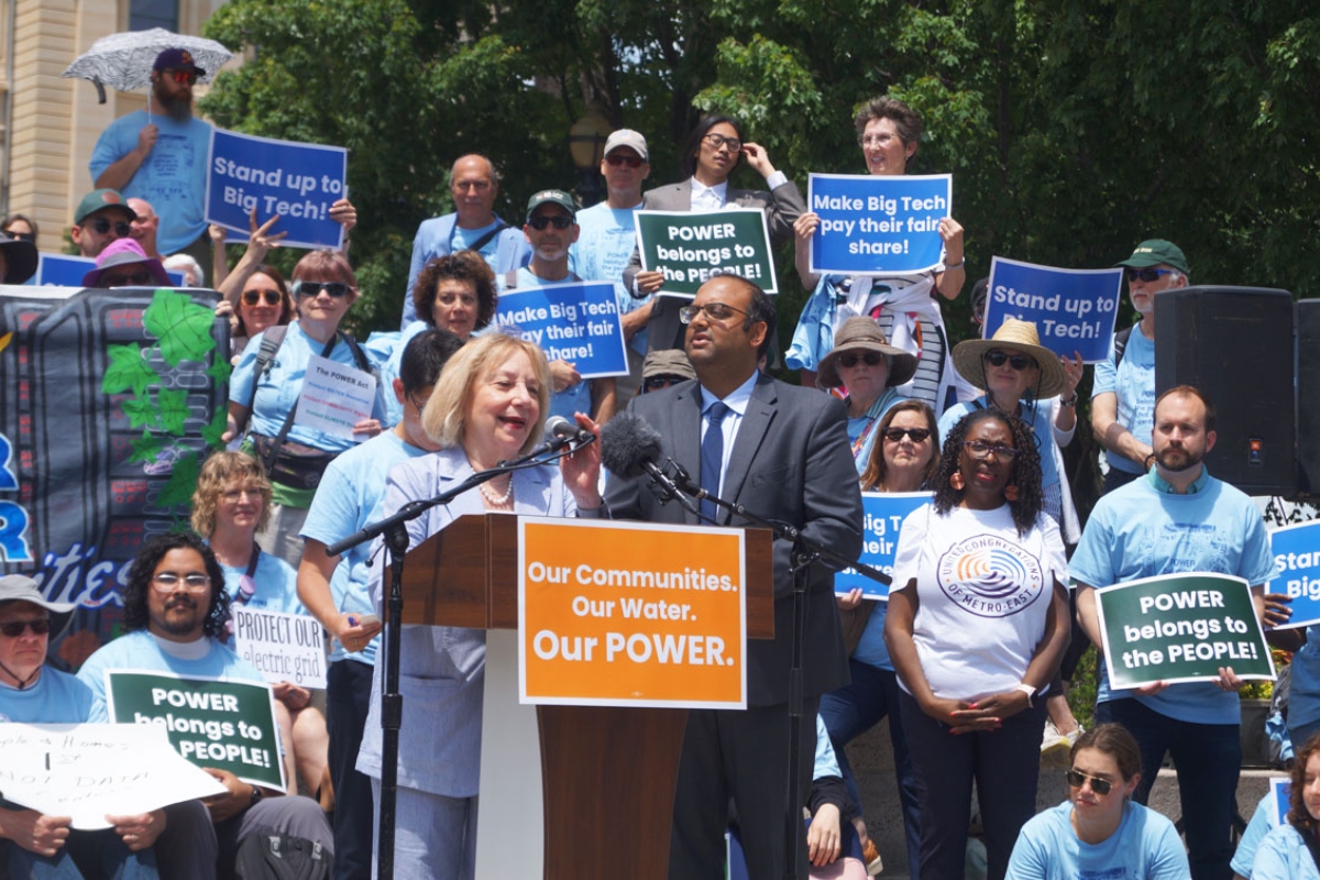 Robyn Gabel, D-Evanston, and Sen. Ram Villivalam, D-Chicago, speak at a rally for the POWER Act, a bill regulating data centers, about the bill’s next steps after the session ends. (Capitol News Illinois photo by Peter Hancock)