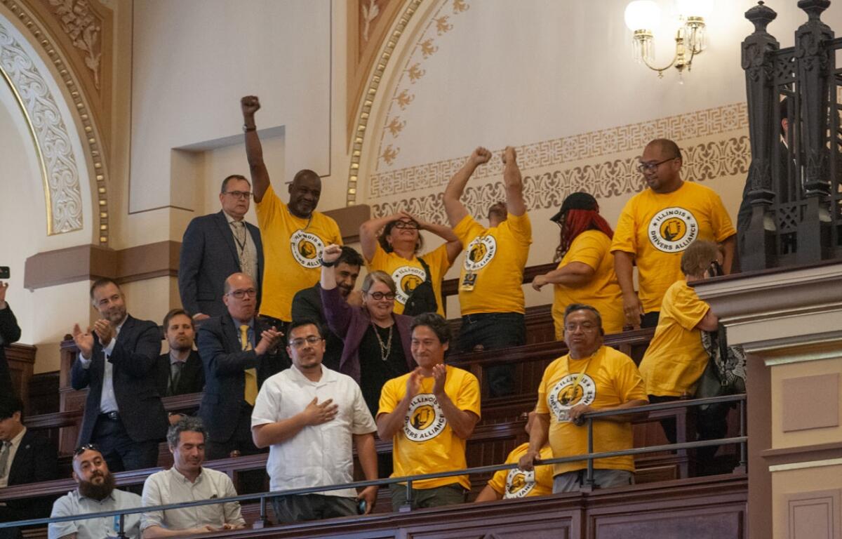 Supporters of the rideshare union bill celebrate in the Senate gallery after the bill passed on the floor. (Capitol News Illinois photo by Jenna Schweikert.)