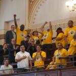 Supporters of the rideshare union bill celebrate in the Senate gallery after the bill passed on the floor. (Capitol News Illinois photo by Jenna Schweikert.)