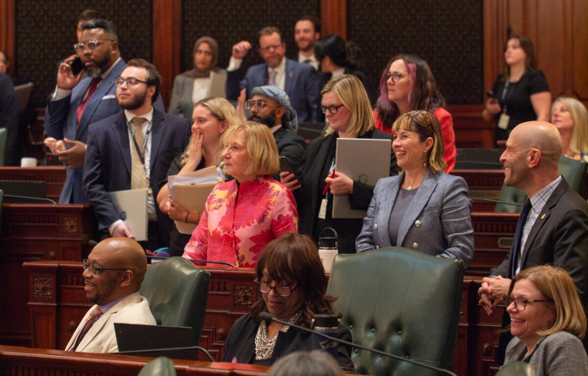 House Democrats surround Rep. Robyn Gabel, D-Evanston, as they vote on the fiscal year 2027 budget in the early hours of June 1, 2026. (Capitol News Illinois photo by Jerry Nowicki)