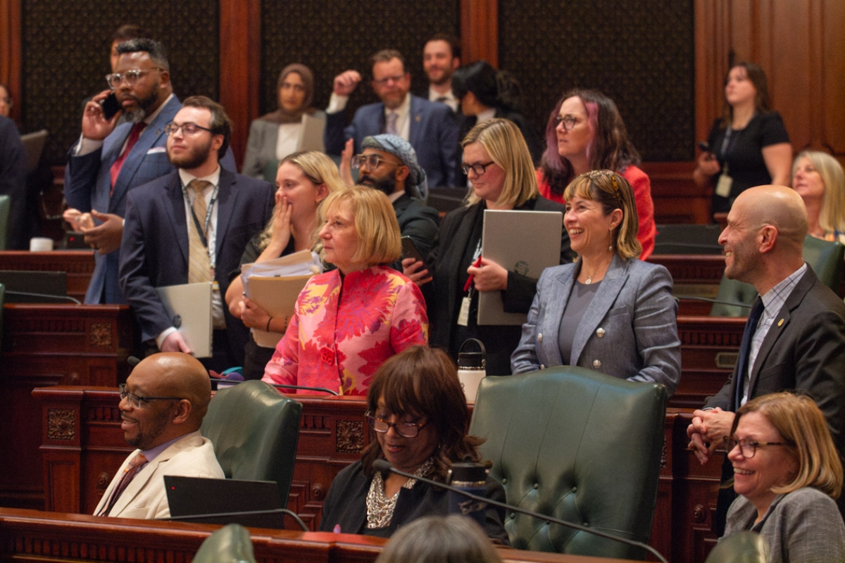 House Democrats surround Rep. Robyn Gabel, D-Evanston, as they vote on the fiscal year 2027 budget in the early hours of June 1, 2026. (Capitol News Illinois photo by Jerry Nowicki)