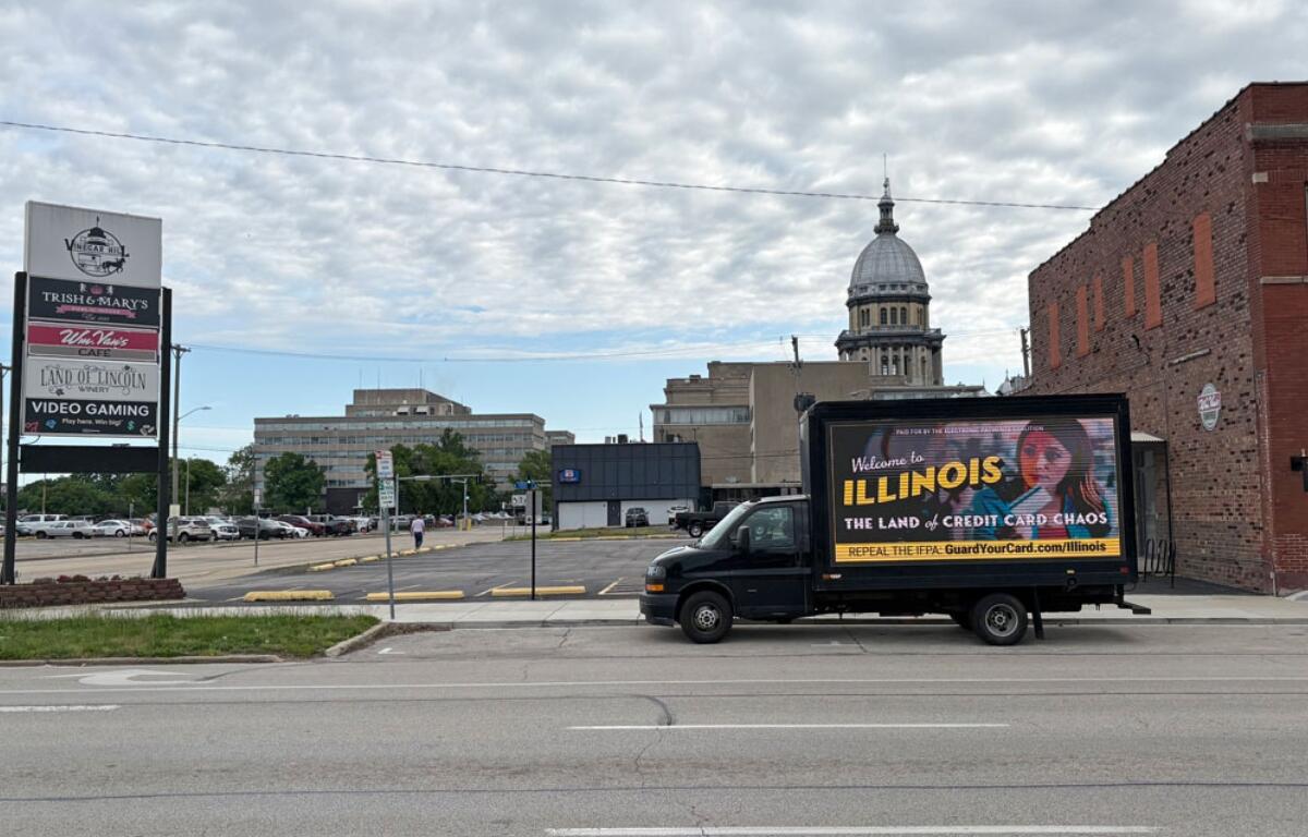 A “Credit Card Chaos” ad appears on a drivable billboard a few blocks from the Illinois Capitol during the legislature’s final stretch. The Illinois law that it targets suffered a pair of setbacks this week. (Capitol News Illinois photo by Jerry Nowicki)