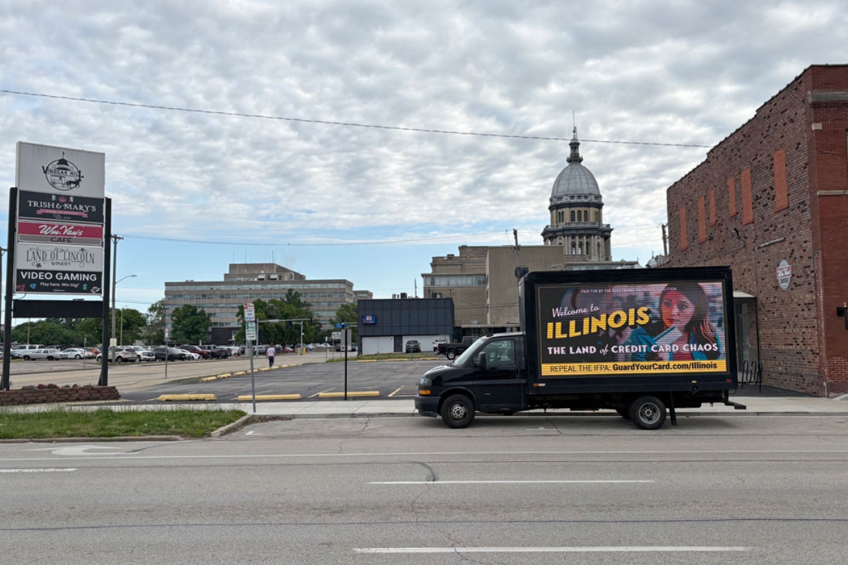 A “Credit Card Chaos” ad appears on a drivable billboard a few blocks from the Illinois Capitol during the legislature’s final stretch. The Illinois law that it targets suffered a pair of setbacks this week. (Capitol News Illinois photo by Jerry Nowicki)