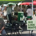 A scene at the station where SNAP users can swipe their EBT card for Link Match vouchers at the Logan Square Farmers Market in Chicago (Medill Illinois News Bureau photo by Molly A. Wallace)