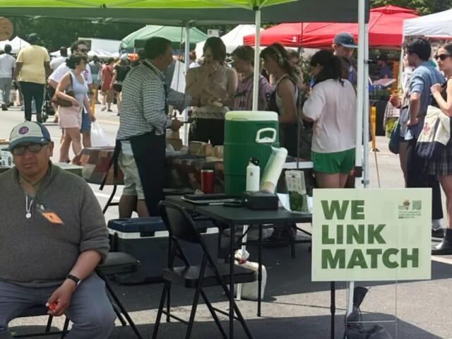 A scene at the station where SNAP users can swipe their EBT card for Link Match vouchers at the Logan Square Farmers Market in Chicago (Medill Illinois News Bureau photo by Molly A. Wallace)