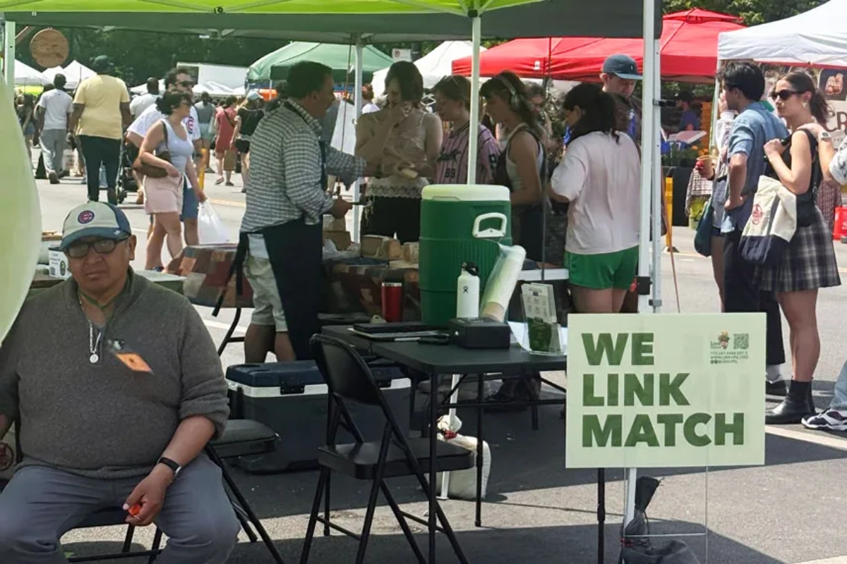 A scene at the station where SNAP users can swipe their EBT card for Link Match vouchers at the Logan Square Farmers Market in Chicago (Medill Illinois News Bureau photo by Molly A. Wallace)