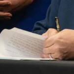 Gov. JB Pritzker signs a bill into law. (Capitol News Illinois photo by Maggie Dougherty)