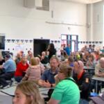 Residents fill Taylorville High School for a meeting on a proposed data center.