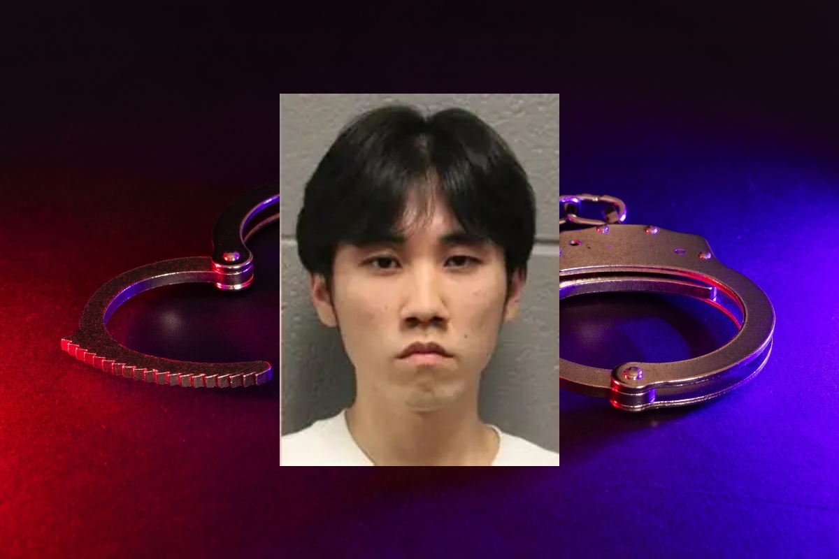 Merlin Lu has been charged with a hate crime after Chicago Police claim he set a cross on fire in the city's Grant Park.