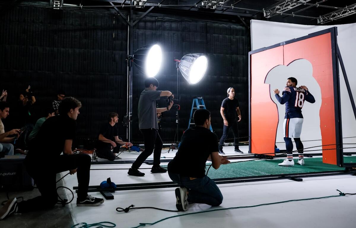 Caleb Williams takes part in a photo shoot for EA Sports "Madden NFL 27" in California.